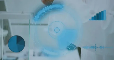 Senior scientist placing sample on balance behind glass shield, causing HUD Stock Footage 331165649