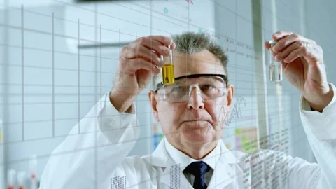 Senior scientist securing goggles and comparing test tubes with animated charts Stock Footage 317869941