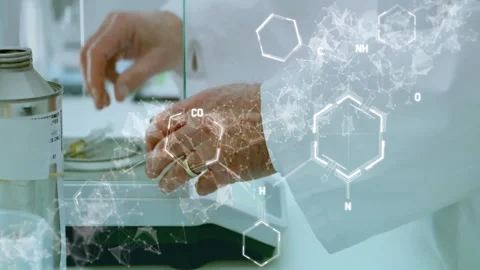 Senior scientist's hand reaching toward petri dish in lab, displaying floating Stockbeeldmateriaal 309287696