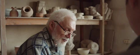 Senior Sculptor Talking with Apprentice in Workshop Stock Footage 167273157