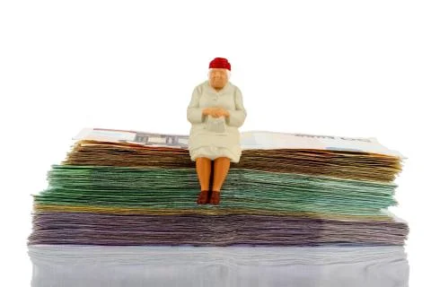 Senior sitting on bills Stock Photos