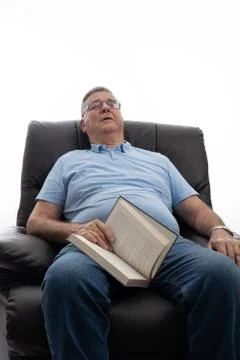 Senior sleeping on a couch Stock Photos