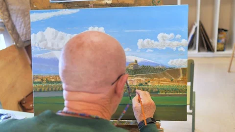 Senior student in painting class working on an oil painting Stock Footage 124368623