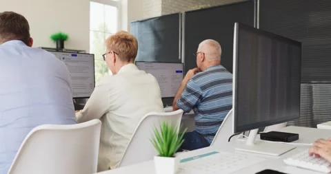 Senior students in computer classroom during training, adult education workshop Stock Footage 341157781