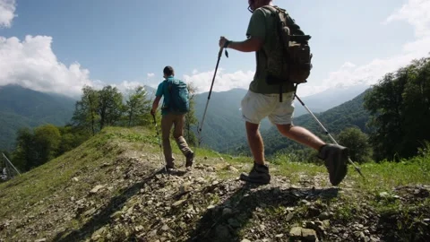 Senior students of geography are moving along mountain range in mountains of Stock Footage 208878233