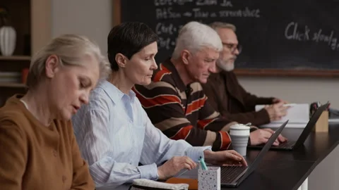 Senior Students Using Laptops in Modern Classroom Stock Footage 329285537