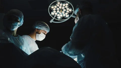 The senior surgeon in the operating room, where the patient is waiting for him Stock Footage 124846247