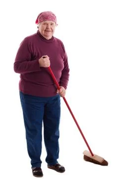 Senior sweeps the floor 스톡 사진
