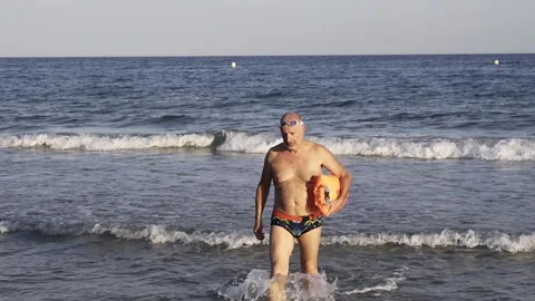 Senior swimmer man doing open water swim routine - Healthy and fit elderly Video stock 159623137