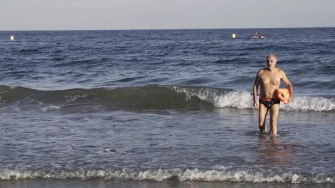 Senior swimmer man doing open water swim routine - Healthy and fit elderly li Stock Footage 159623187