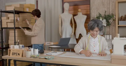 Senior Tailor Drawing Sewing Patterns In Professional Apparel Workshop Medi.. Stock Footage 336247452