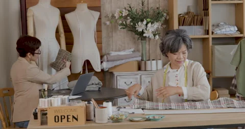Senior Tailors Measuring Fabric For Custom Apparel In Creative Workshop Med.. Video stock 336247620