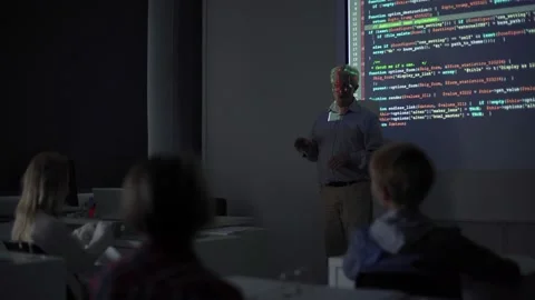 Senior teacher explaining programming presentation to students Stock Footage 142494792