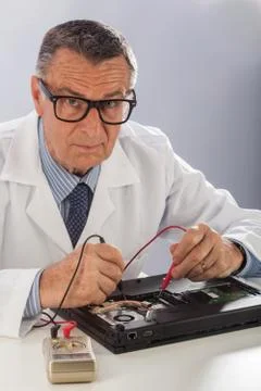 Senior technician with multimeter Stock Photos