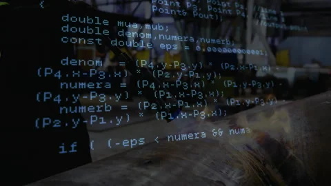 Senior technician operating workbench in factory, with code overlay showing 스톡 동영상 308100343