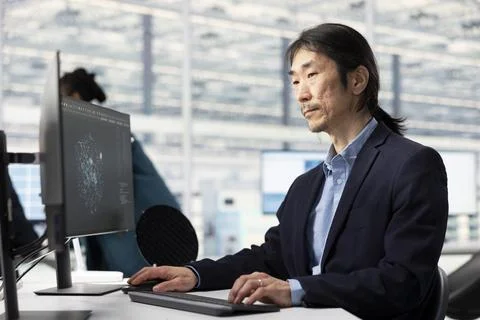 Senior technician using AI to optimize PCB production in factory research office Stock Photos