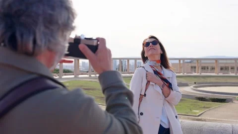 Senior tourist posing while husband taking photo. Video stock 271009533