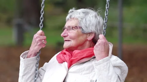 Senior using a swing. Video stock 43133206