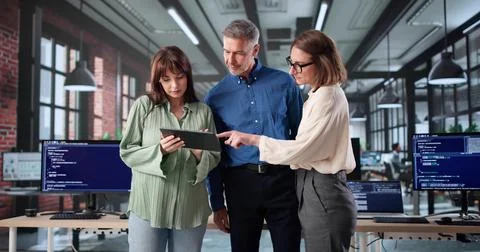 Senior Web Developers Program Code In Classroom Meeting At Night 写真素材