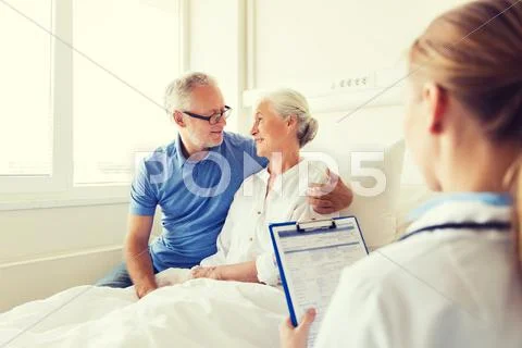 Senior woman and doctor with clipboard at hospital Stock Photos