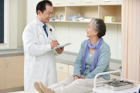 Senior Woman Being Examined by a Doctor Stock Photos