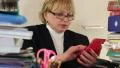 Senior woman chief accountant in glasses and with red smartphone HD Footage