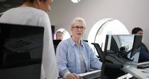 Senior woman on computing course Stock Footage 86514924