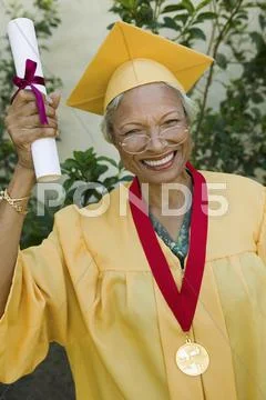 Senior Woman With Degree And Medal Stock Photos