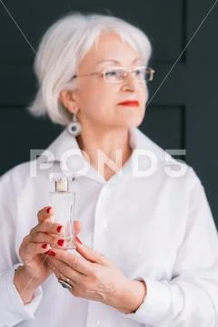 Senior woman fashion style perfume trend hands Stock Photos