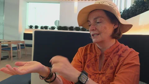 Senior Woman Gesturing While Talking Indoors Stock-Footage 312804835