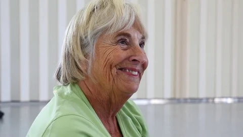 A senior woman getting instruction in an exercise class Stock Footage 73098160