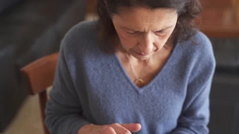 Senior woman having difficulty learning to use tablet Stock Footage 188940650