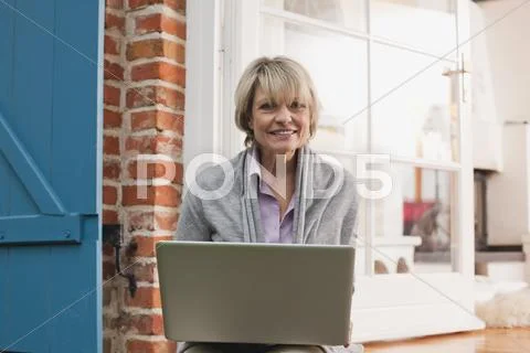 Senior Woman With Laptop, Smiling, Portrait