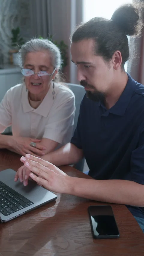 Senior Woman Learning Computer Skills from Instructor at Home Stock Footage 337008027