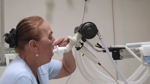 Senior woman testing breathing function by spirometry	 Video stock 201384959