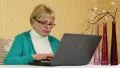 Senior woman types text uses laptop. Woman with notebook HD Footage