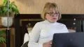Senior woman types text uses laptop. Woman with notebook HD Footage