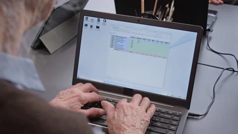 Senior Woman Typing on Keyboard in Computer Class for Seniors Stock Footage 333703394