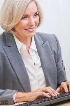 Senior woman using computer Stock Photos