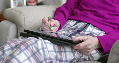 Senior Woman Using Digital Tablet: Stock Footage 337221375