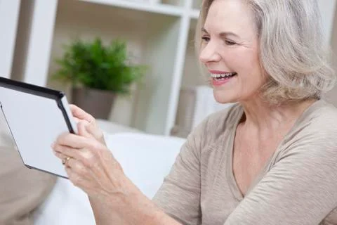Senior woman using tablet computer Stock Photos