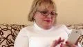 Senior woman using white mobile phone HD Footage