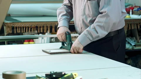 Senior worker finishing frame in workshop Stock Footage 119612932