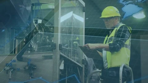 Senior worker standing on step tapping tablet, initiating factory inspection, Stock Footage 335317030