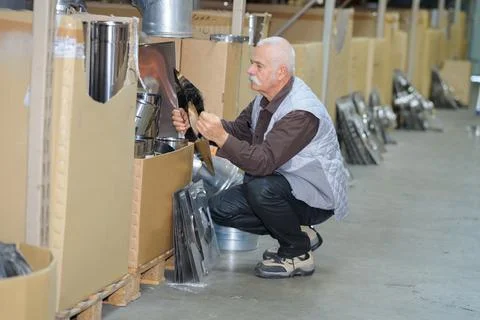 A senior working with checkerplate Stock Photos
