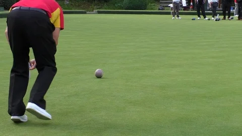 Seniors playing lawn bowls Stock Footage