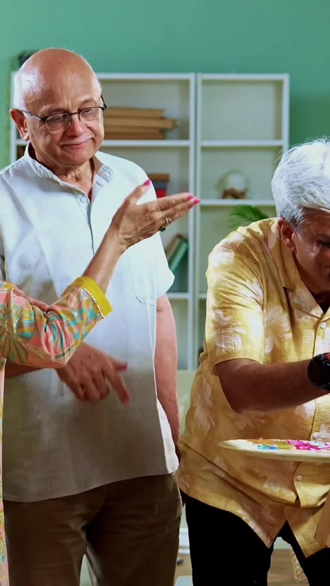 Seniors singing while playing guitar together during indoor musical reunion Stock Footage 342387297
