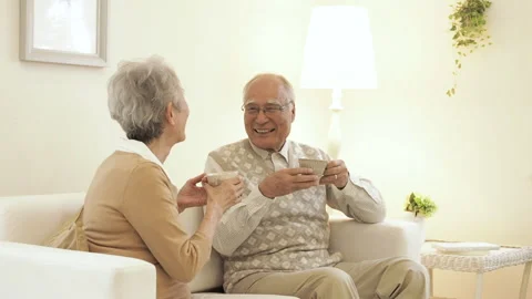 Seniors Sitting on a Sofa Stock Footage 334639740