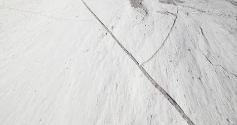 Senital gimbal stabilized camera movement of white cracked pumice rock texture Vidéo 103489029