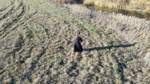Senpai practices basic techniques from a standing position. Kyudo technique 库存影片 127860083